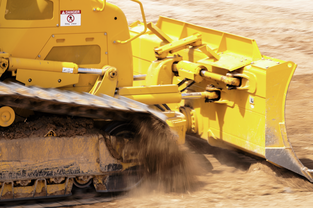 Komatsu D71-24 dozer: A close up of the movement of the dozer as it moves dirt
