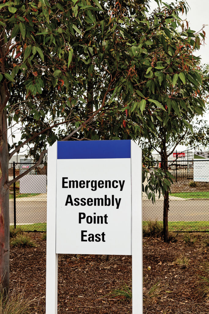 A sign outside that says Emergency Assembly Point East