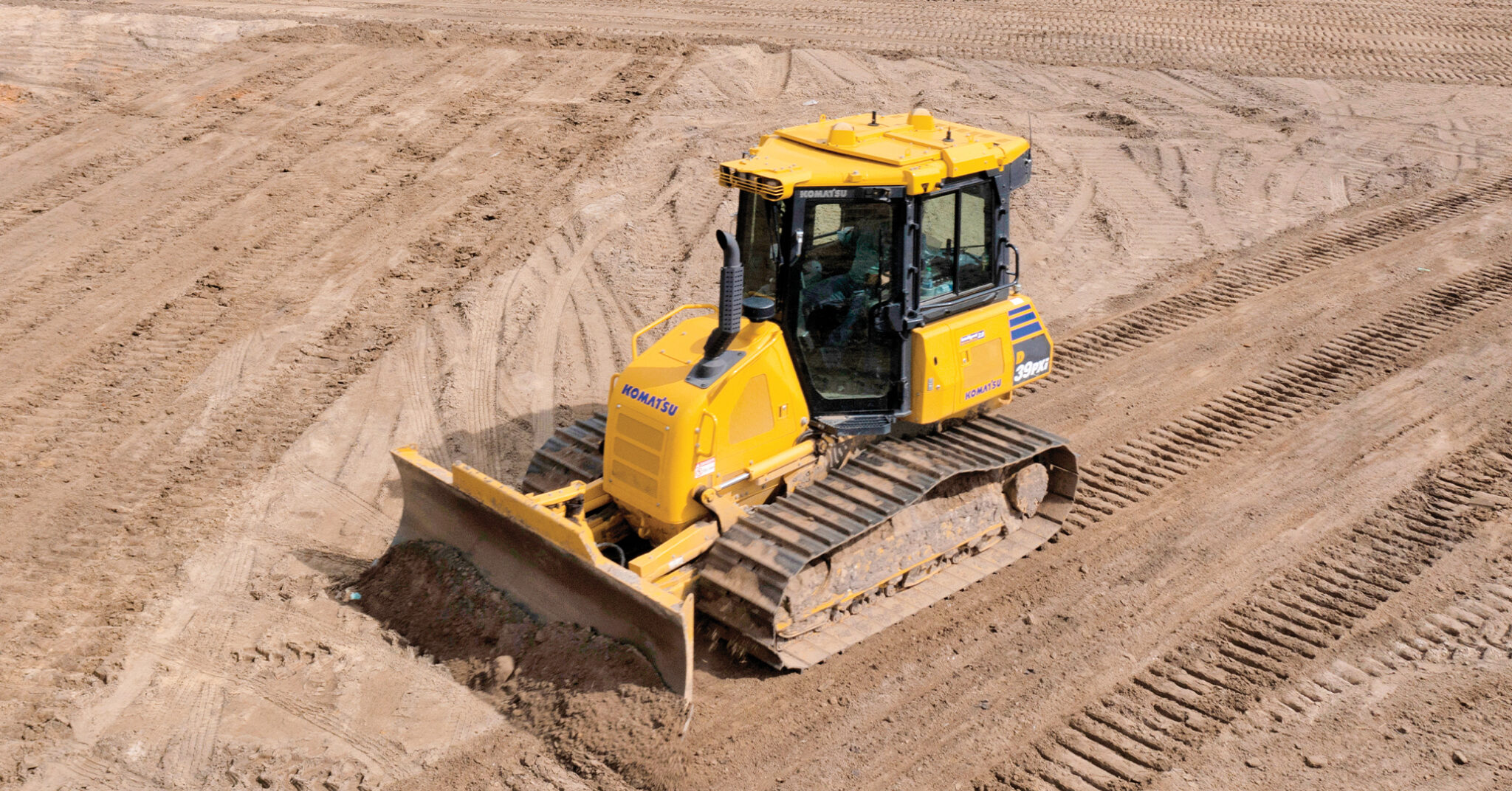 JW Oliver Construction Inc. | Pictured: A JW Oliver operator cuts a new baseball field to grade with a Komatsu D39PXi-24 intelligent Machine Control (iMC) dozer.