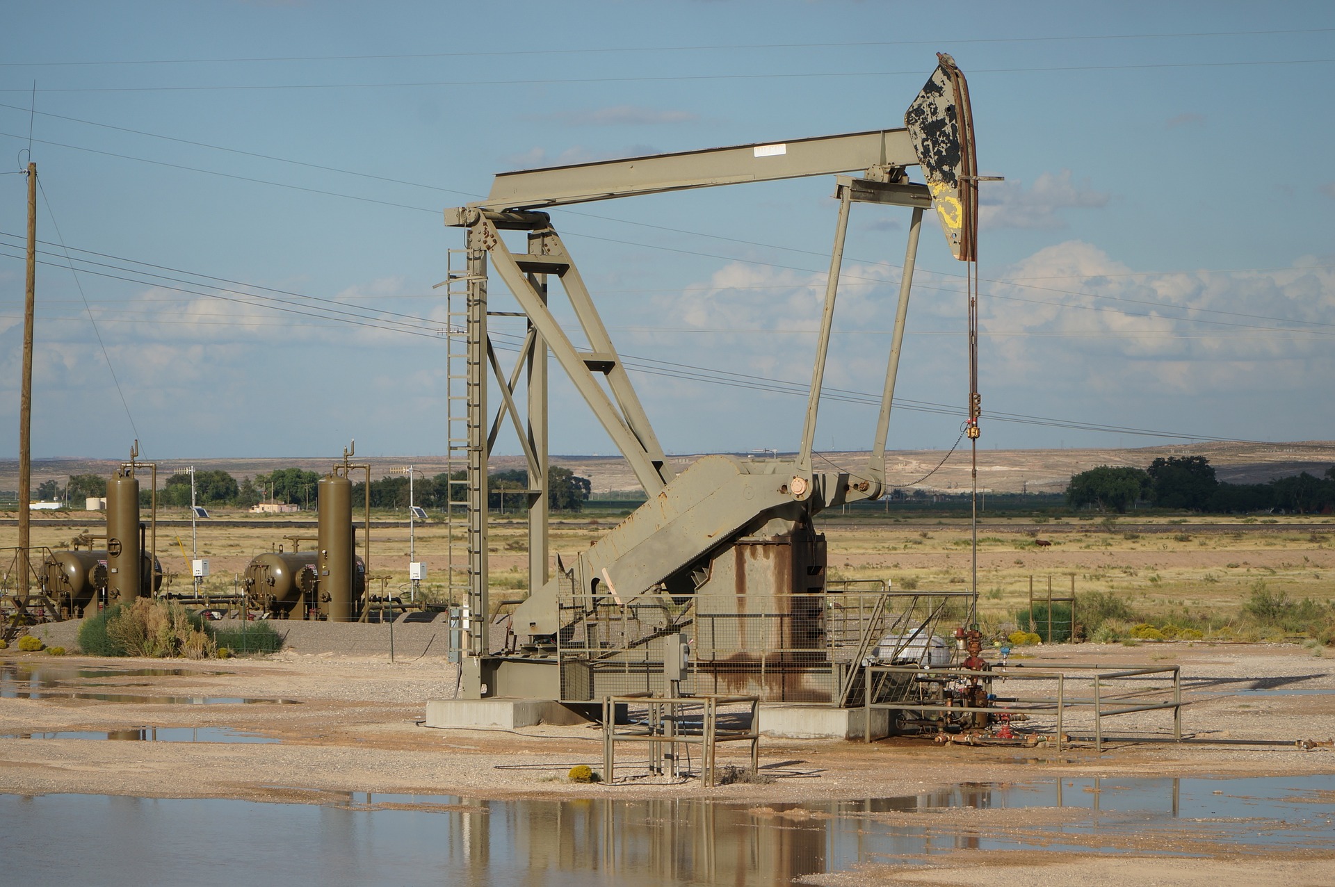 An oil pump standing in a flat desert