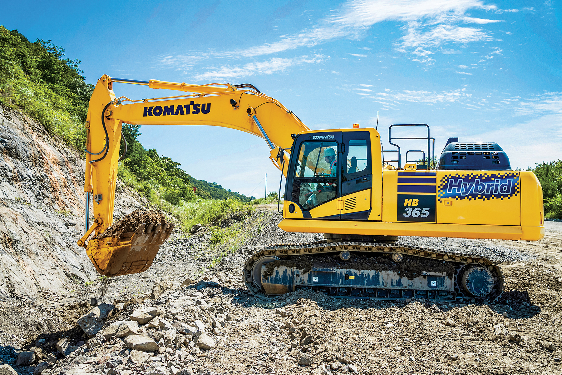 Komatsu's Hybrid HB365LC-3 Excavator moving dirt