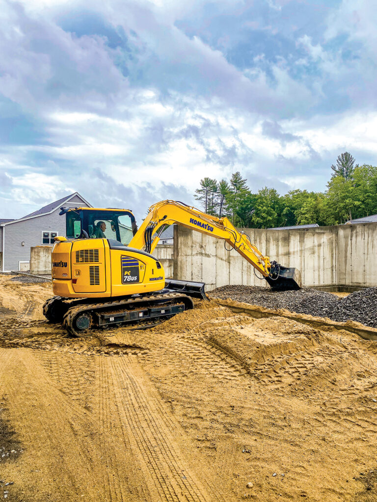 An image of a Komatsu PC78US-10 working in a residential area