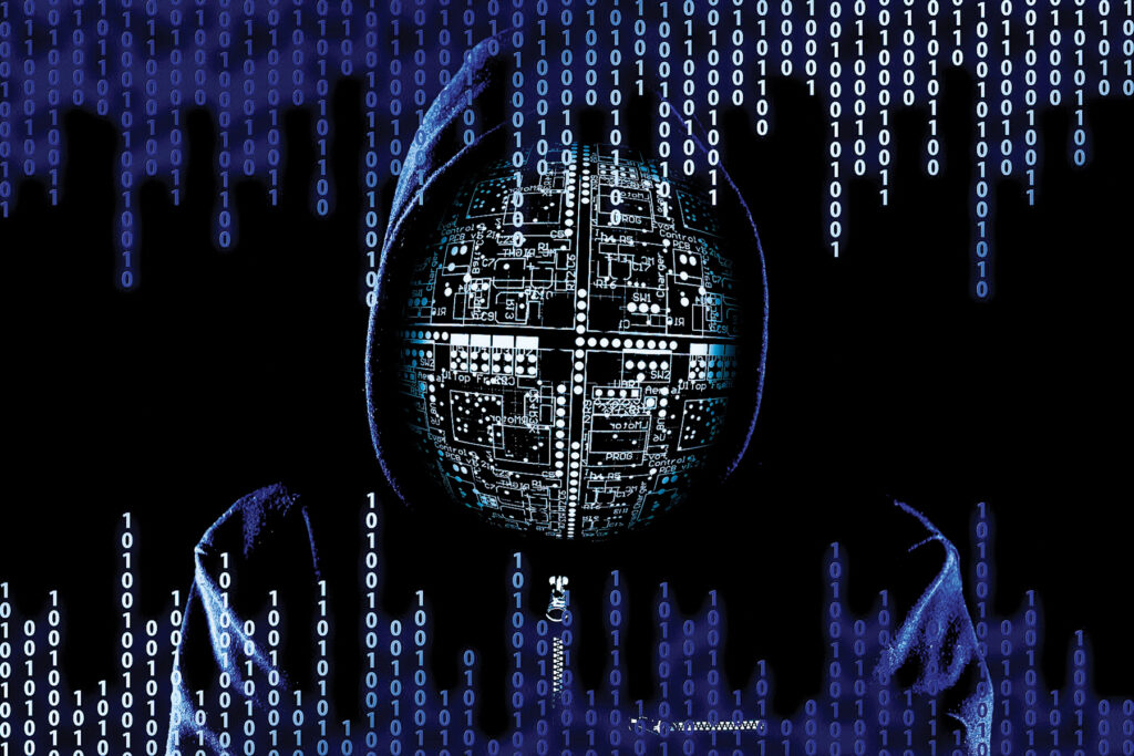 An image of a man in a hood with computer binary and a computer chip pattern superimposed over top