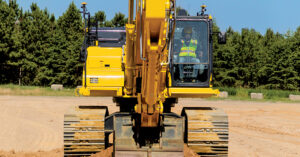 An operator operating a PC490LCi-11, Komatsu’s largest intelligent Machine Control (iMC) 2.0 excavator