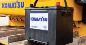 A Komatsu battery sitting on a Komatsu machine