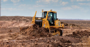 A Komatsu D65EXi-18 moving dirt