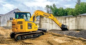 An image of a Komatsu PC78US-10 working in a residential area