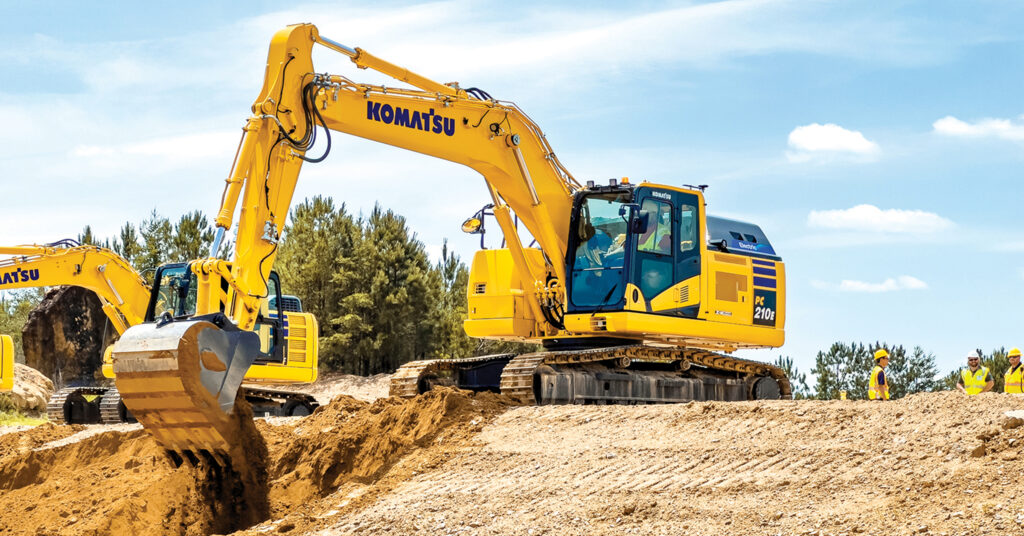 Komatsu’s PC210LCE electric excavator moving dirt at Komatsu's Demo Days