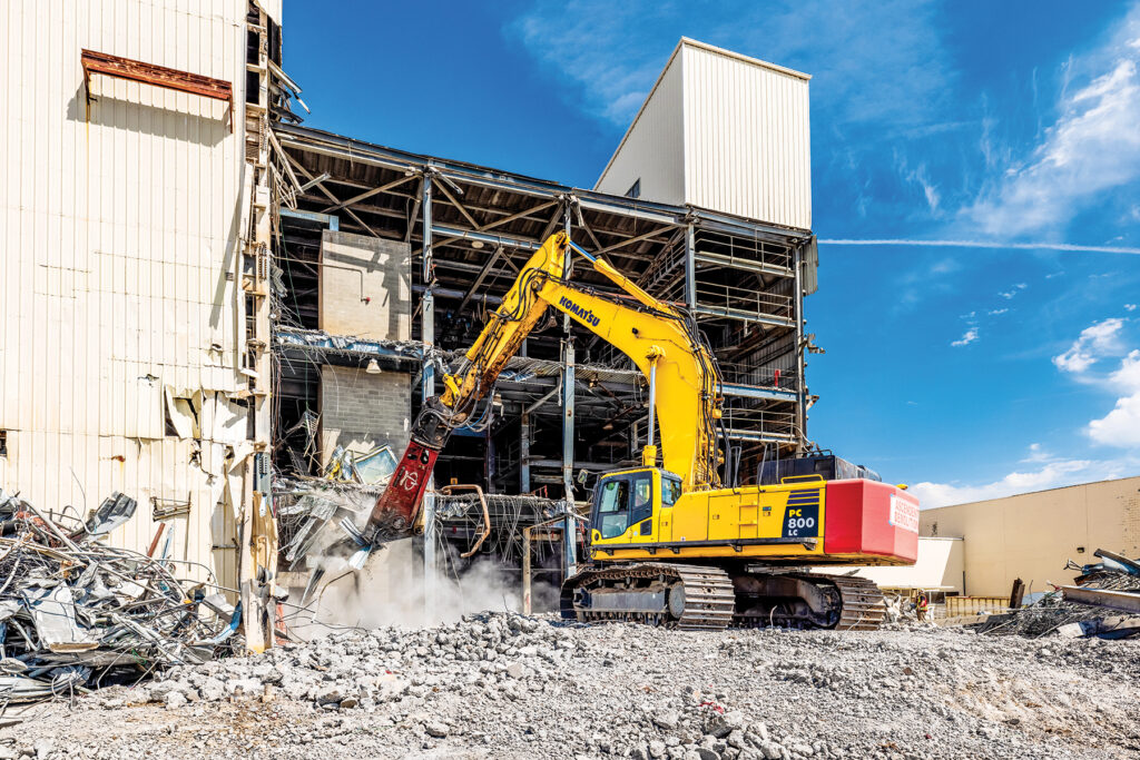 Ascendent Demolition LLC's Komatsu PC800LC demolishes a building