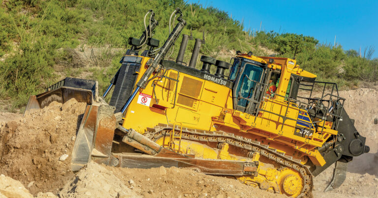 Komatsu's US national field services team expanding its mining service capabilities is shown with a Komatsu D375A Dozer