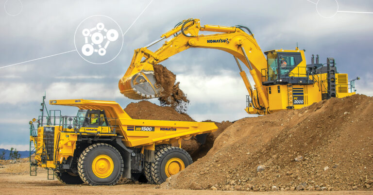 A Komatsu PC20000 excavator placing dirt into the bed of a Komatsu HD1500 haul truck. This highlights some of the machines the iVolve acquisition will benefit.